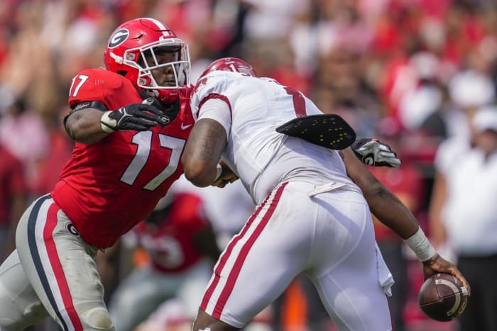 Georgia linebacker Nakobe Dean (17) tackles Arkansas quarterback KJ Jefferson (1). Mandatory Credit: Dale Zanine-USA TODAY Sports